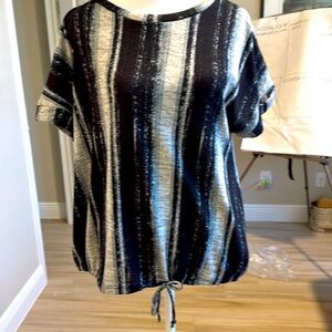 Polyester/spandex soft top. Vertical stripes